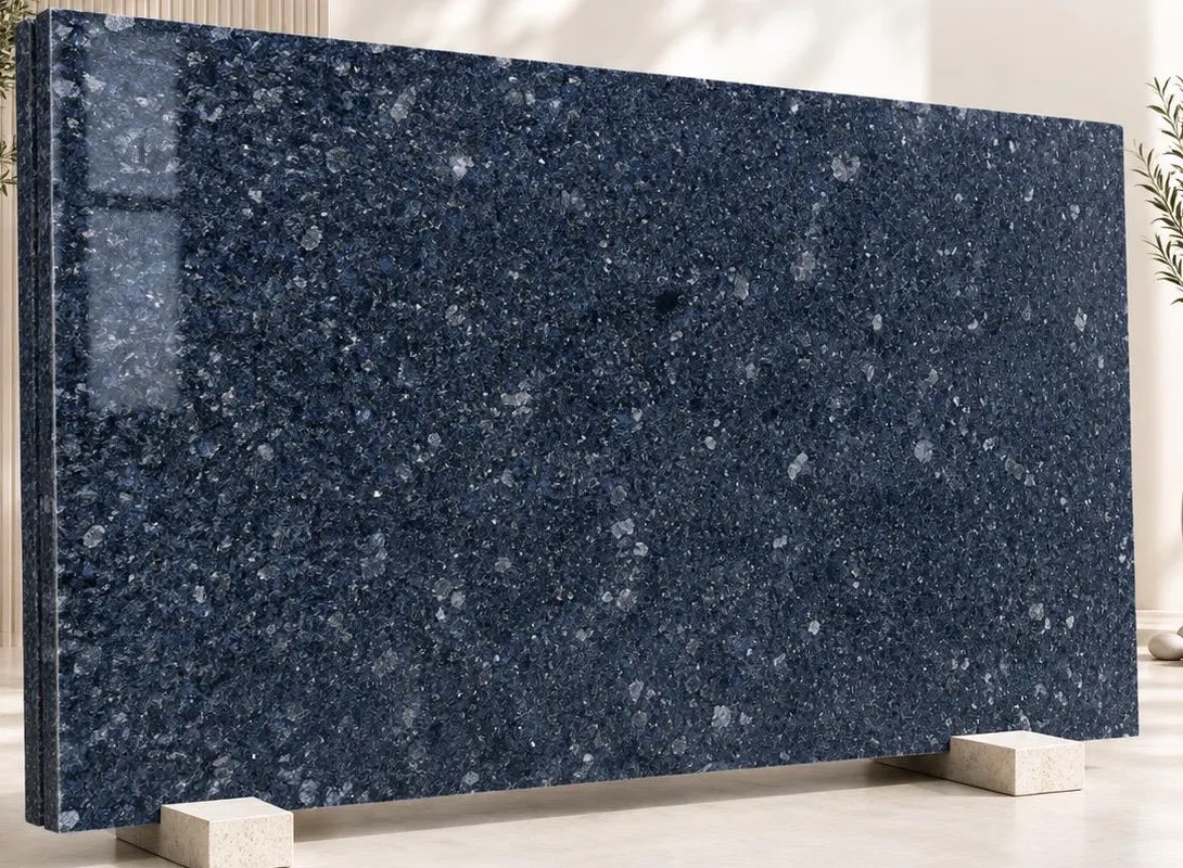 Ice Blue granite: a deep marine-blue polished surface scattered with pale crystal flecks of feldspar