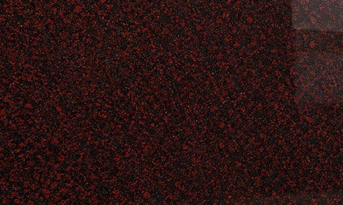Kondakattu Red granite: rounded oxblood-red crystals set in a near-black polished ground, with deep lacquer-like reflections