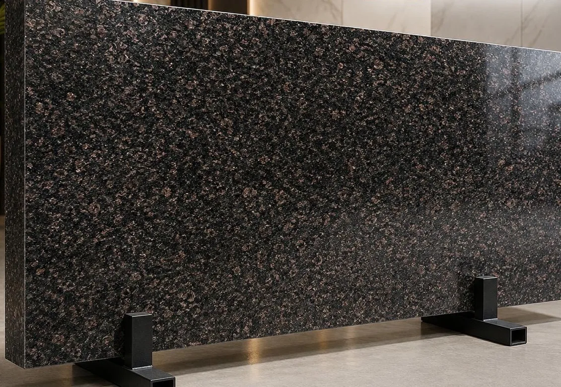 Shankrapally granite: a deep black polished surface scattered with warm copper-brown flecks