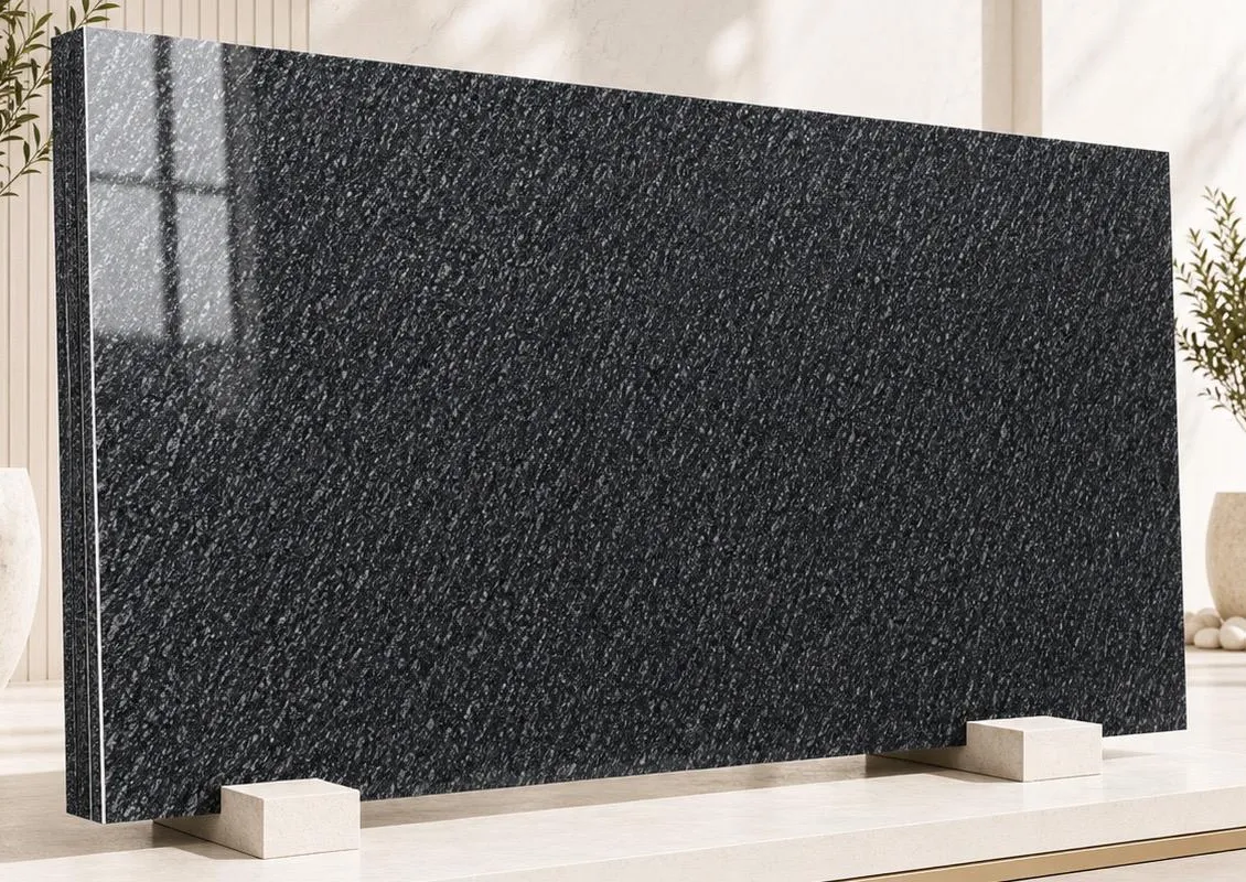 Silver Black granite: a deep black polished surface with fine silver mica flecks in a diagonal drift across the slab