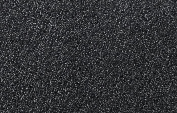 Silver Black granite: a deep black polished surface with fine silver mica flecks in a diagonal drift across the slab
