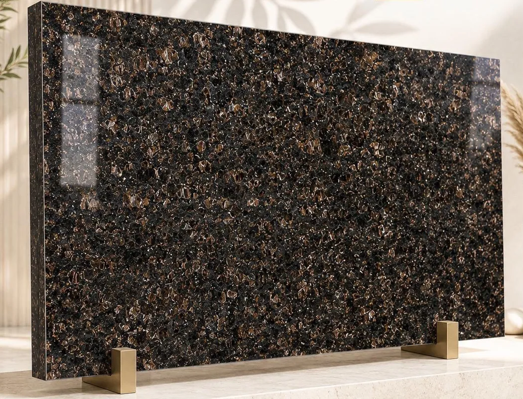 Tan Brown granite: rounded tan-brown crystals set in a near-black polished ground